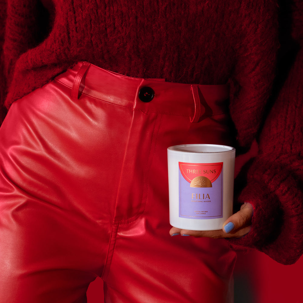 
                      
                        Large Filia Crystal Soy Candle modelled by a woman in an all red outfit holding on to the candle. Gifts for friends who love candles. Crystal infused candle.
                      
                    
