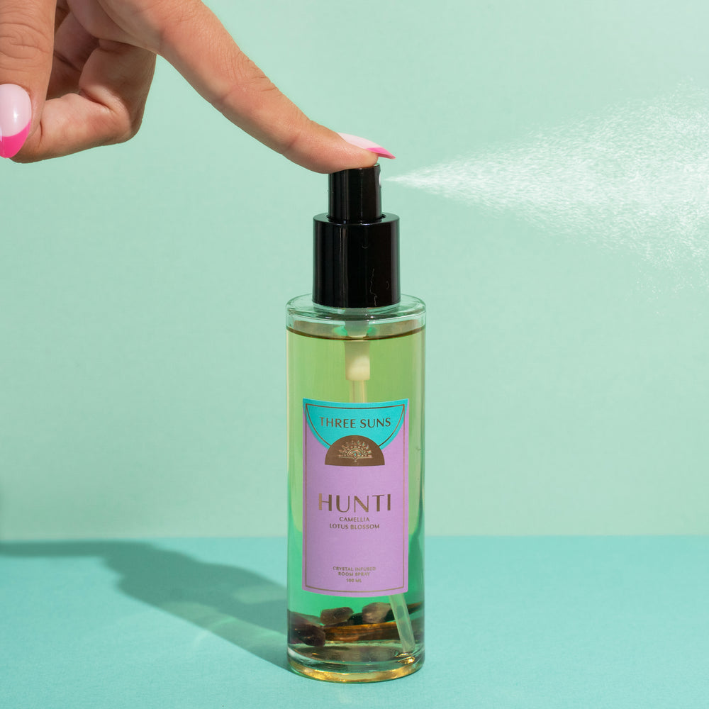 
                      
                        Three Suns Hunti Crystal Room Spray, infused with Amethyst and Tiger’s Eye crystals, calming floral and sandalwood scent, premium Australian perfume-based room spray for relaxation. Linen spray.
                      
                    