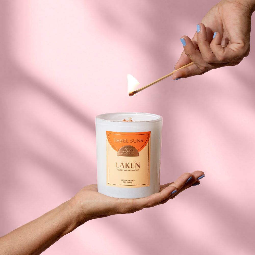 
                      
                        Crystal Infused Laken Large Candle, tropical coconut magnolia scent with Carnelian crystals, natural soy wax, premium Australian home candle by Three Suns.
                      
                    