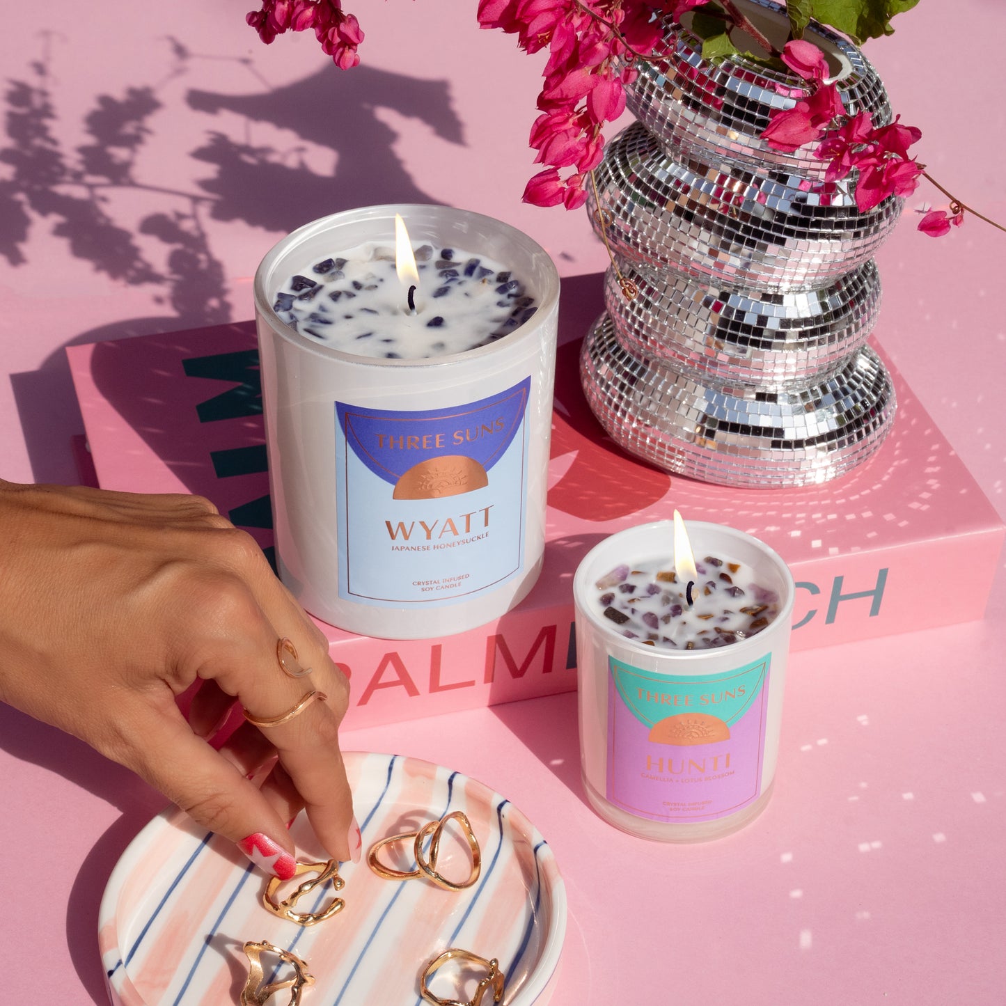 Hunti Mini Crystal Infused Soy Candle with Amethyst and Tiger’s Eye crystals, calming Camellia and Lotus Blossom scent, luxury small candle Australia by Three Suns. Wyatt Crystal Infused Soy Candle with Sodalite crystals, triple-scented Japanese Honeysuckle fragrance, eco-friendly and hand-poured, luxury candles Australia by Three Suns.