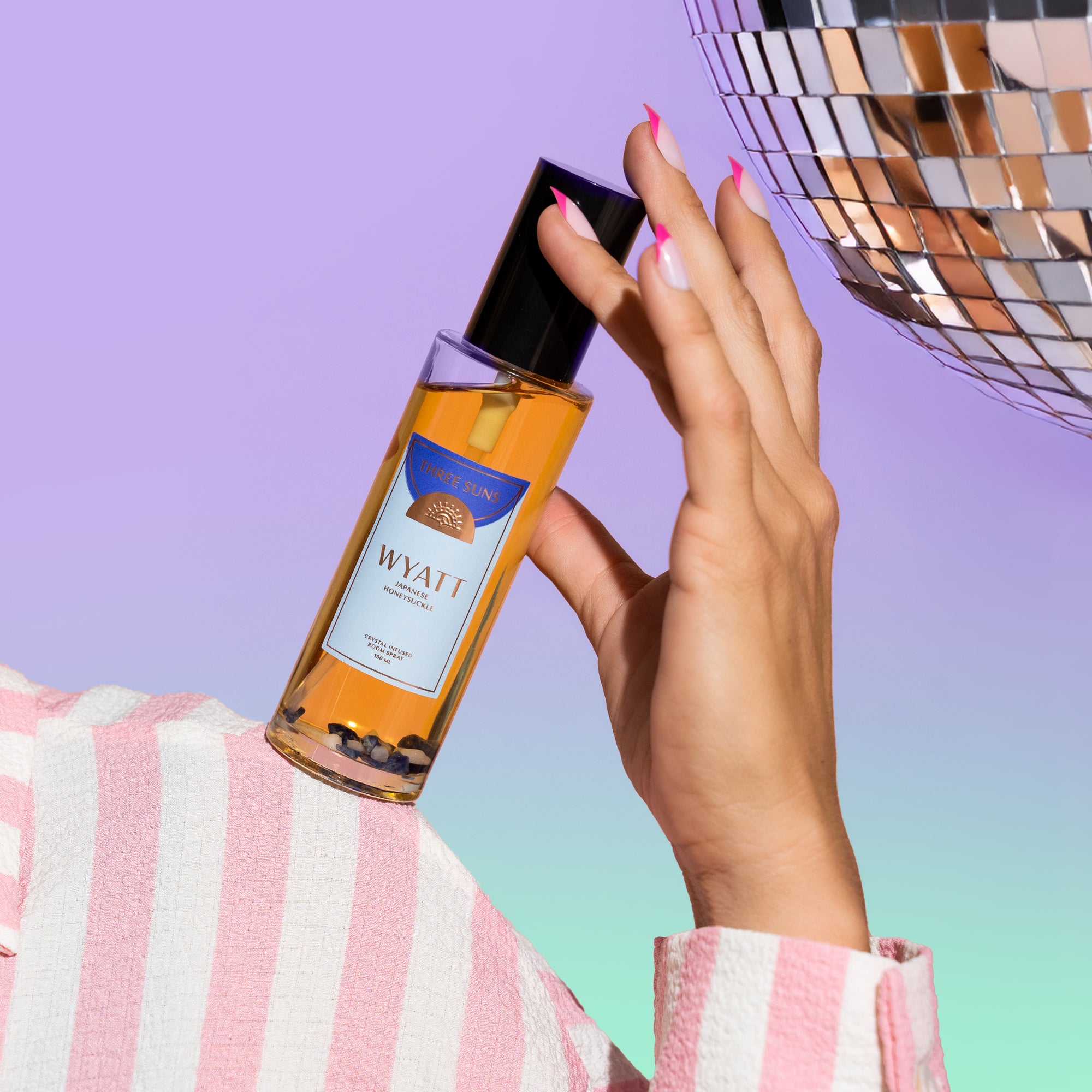 Wyatt Room Spray with black lid, crystal infused Japanese Honeysuckle home fragrance featuring Sodalite crystals for empowerment and clarity, luxury room spray by Three Suns Australia.